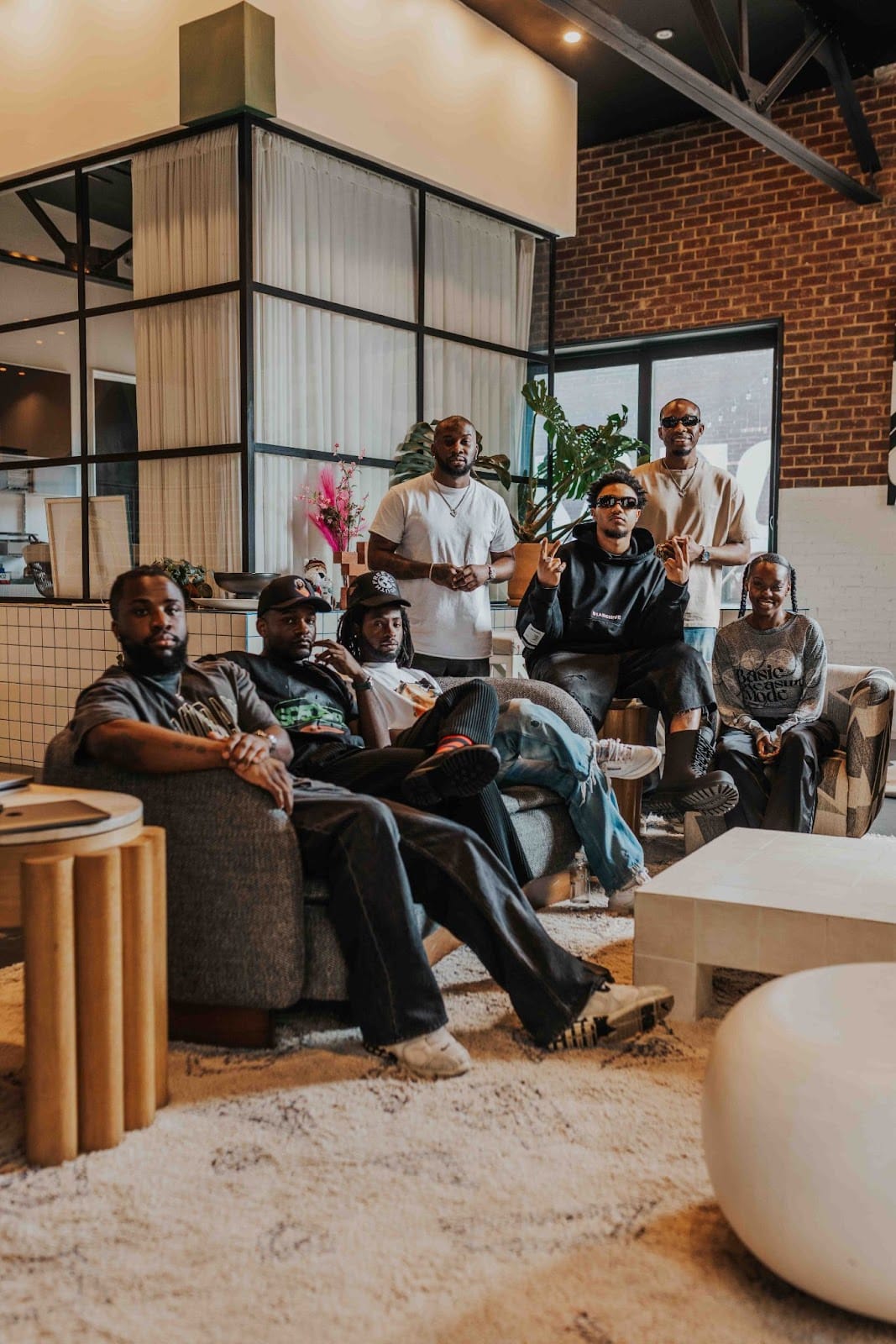 From left to right: Junia Abaidoo (Head of Touring & Operations at LVRN), Sean Famoso - (LVRN Co-founder), Justice Baiden (Head of A&R at LVRN), Carlon Ramong (Creative Director at LVRN), Jade Busola (Artist Manager), Thisizlondon (Artist), Tunde Balogun (CEO of LVRN)